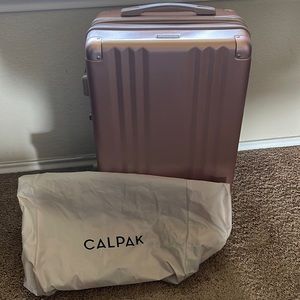 Calpak Ambeur Rose Gold Carry-on Suitcases